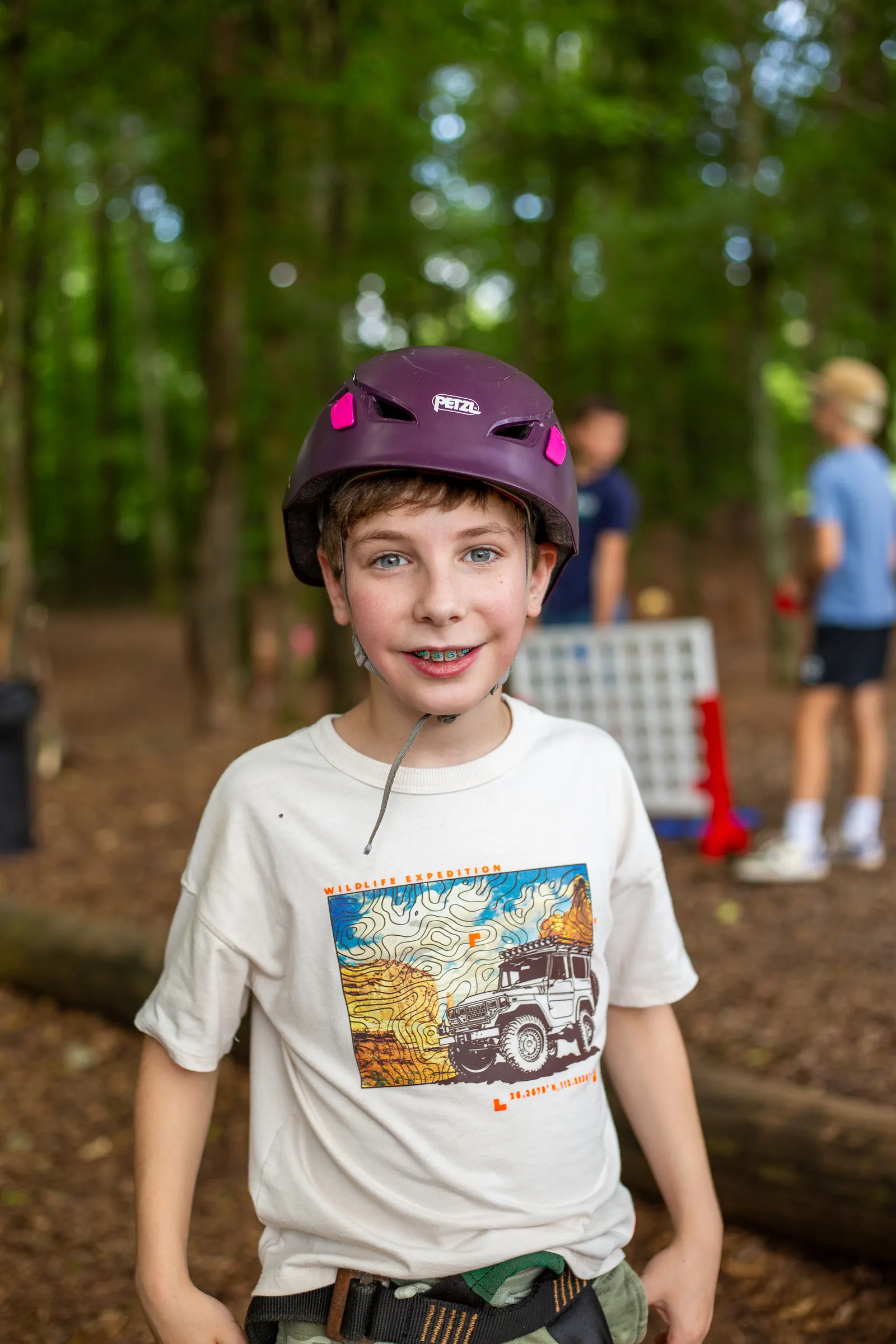 Camper in a helmet smiling