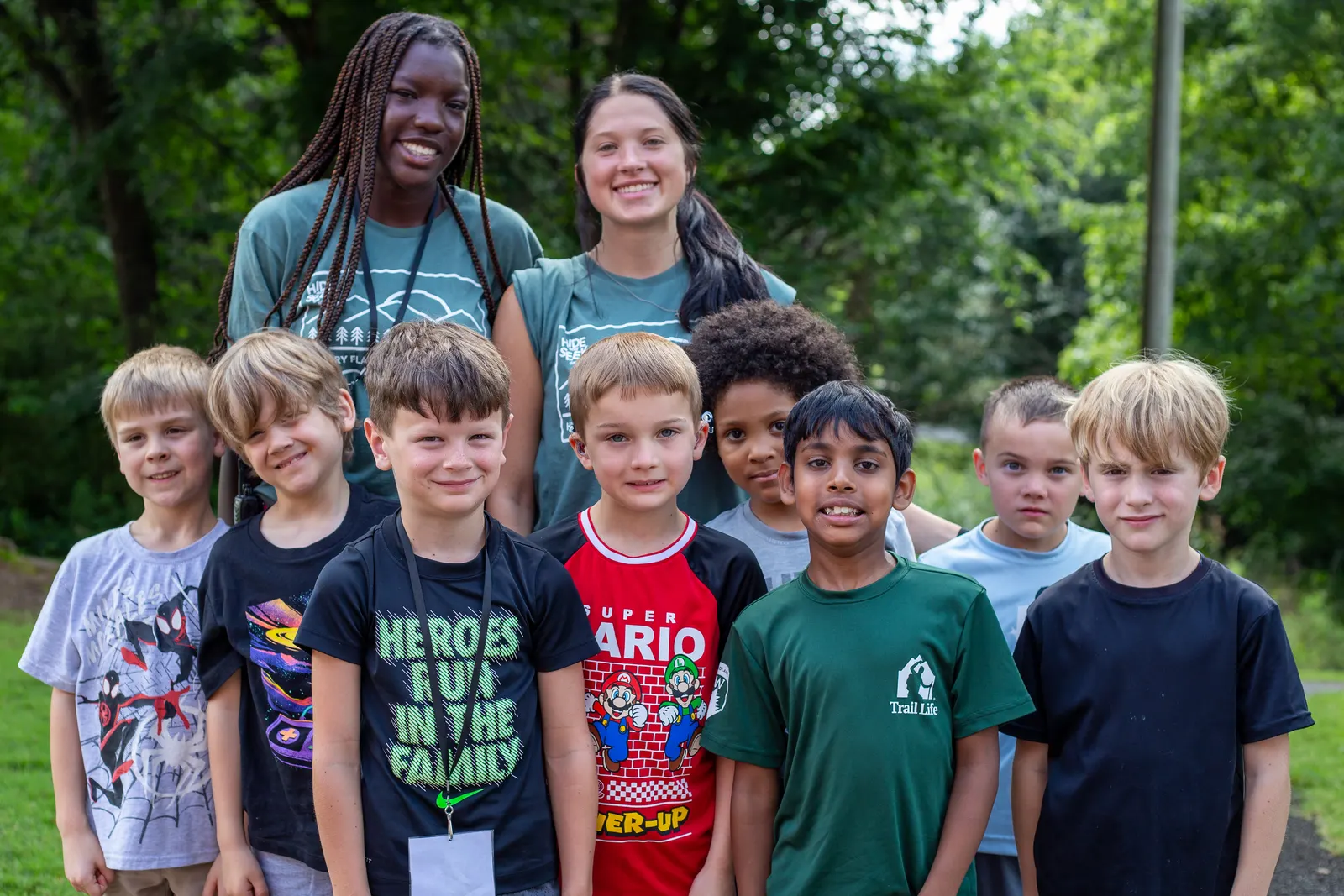 Two counselors with a group of boys