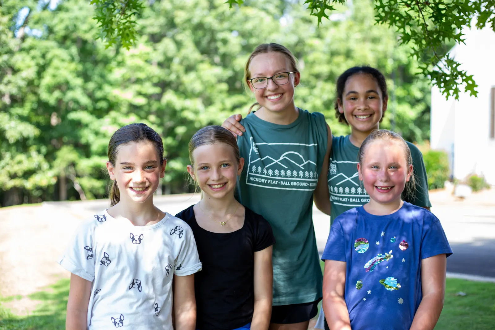 Two counselors with four campers