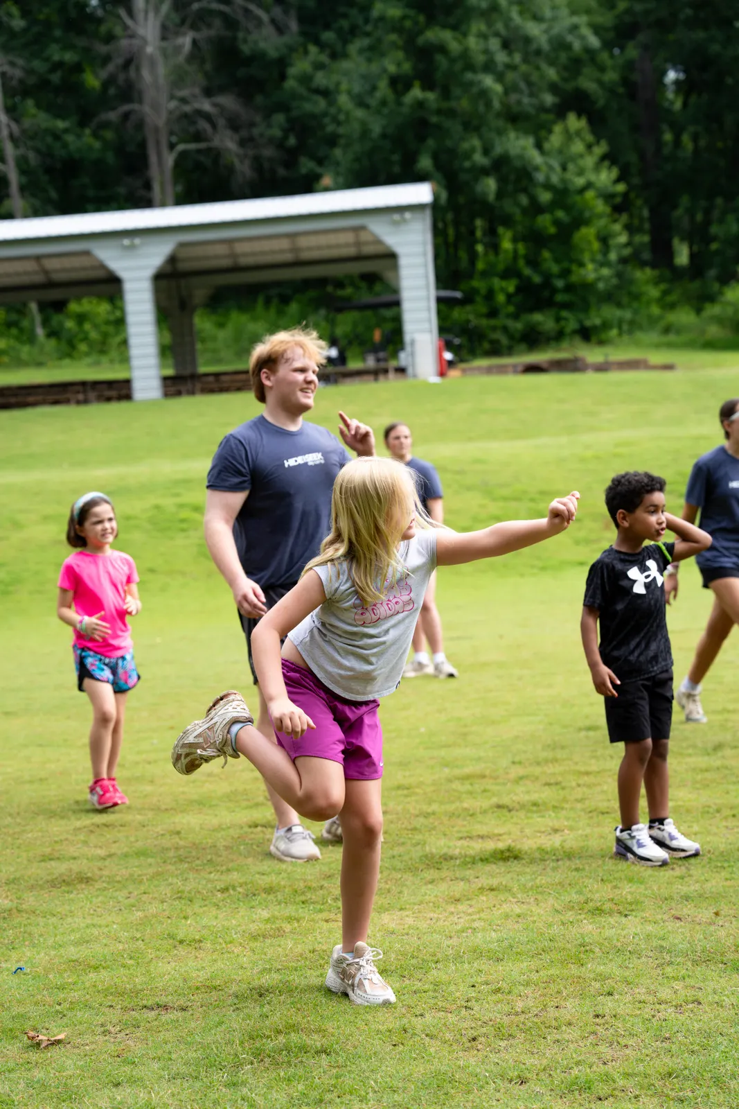Campers running and playing on the field