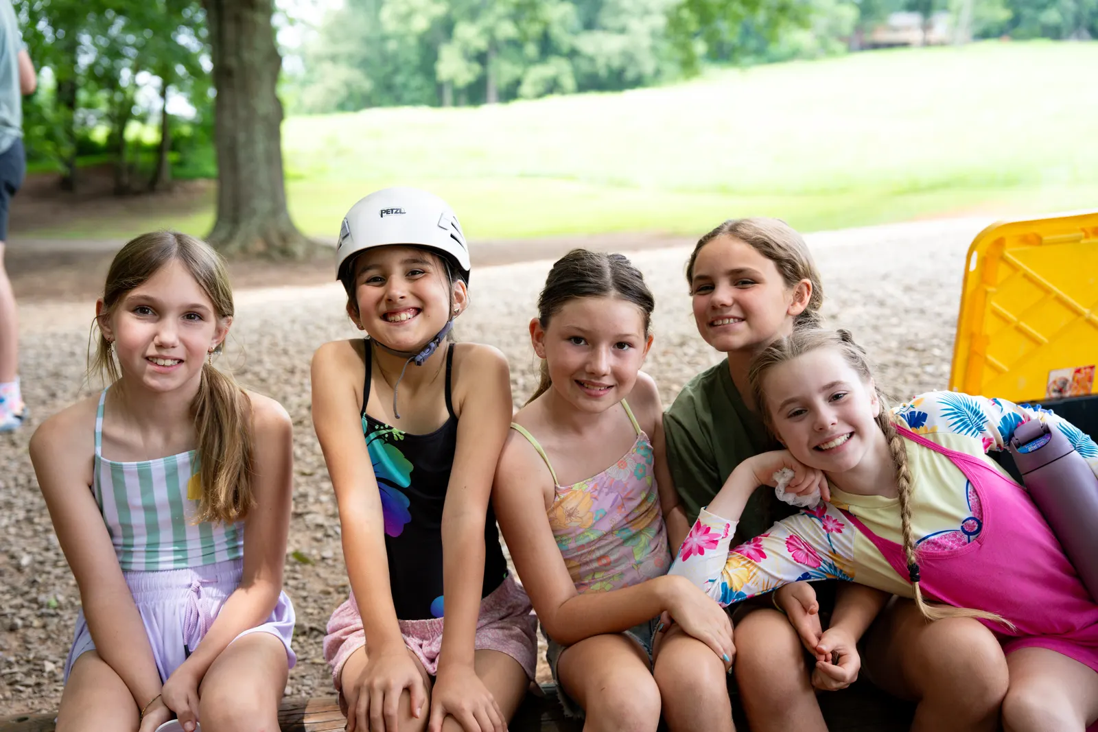 Campers sitting together smiling
