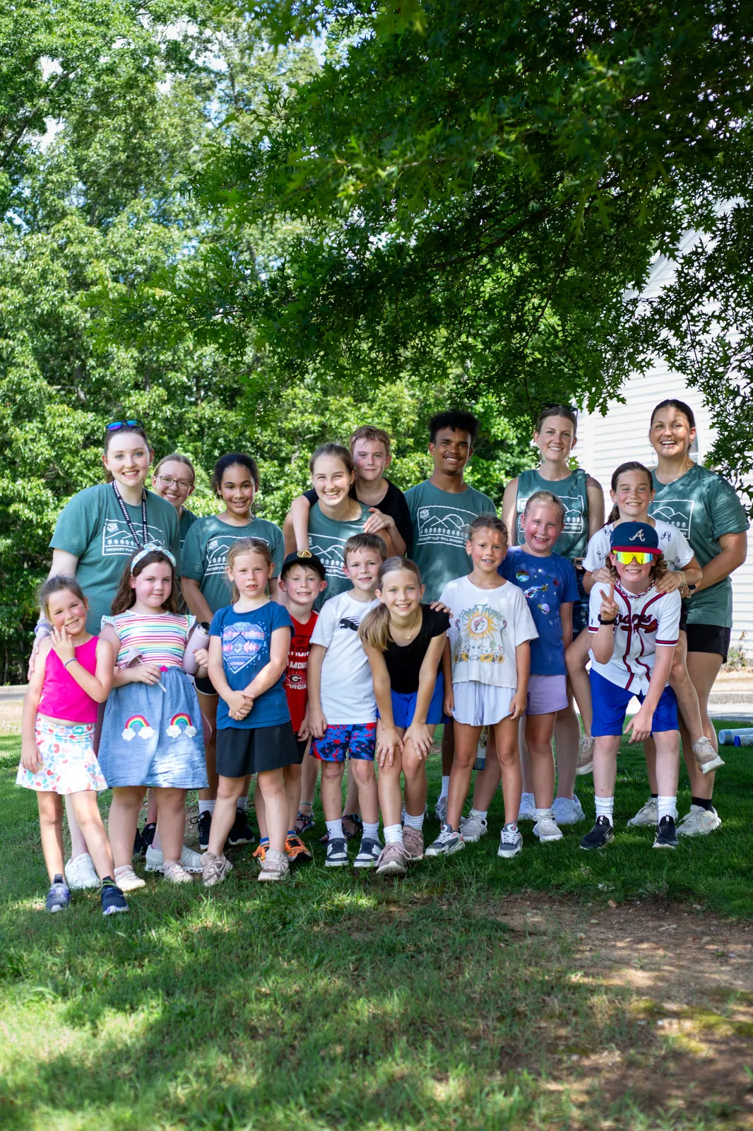 Campers and counselors gathered on the grass