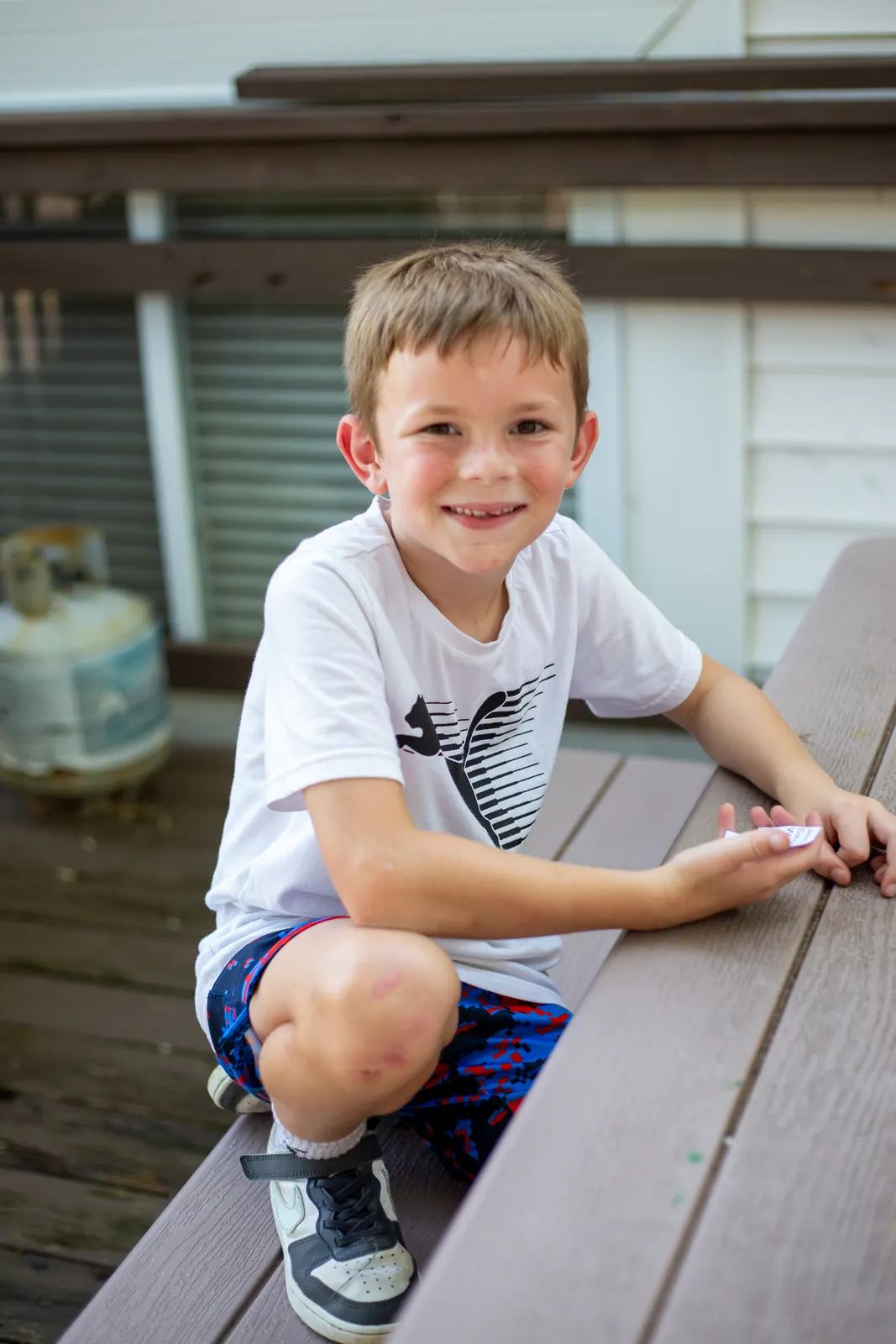 Camper sitting at a picnic table