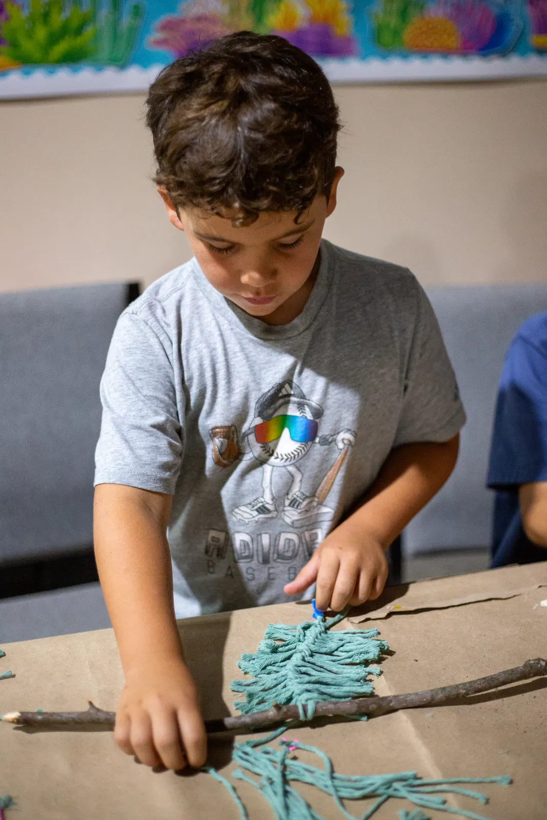 Camper working on a string craft