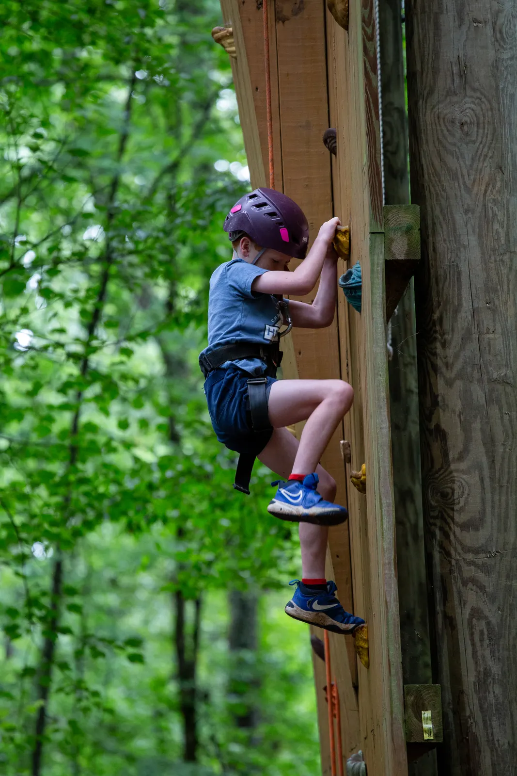 Camper climbing the rock wall