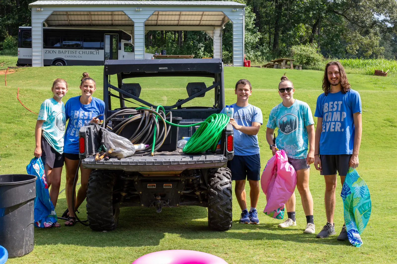 Counselors with the camp utility vehicle