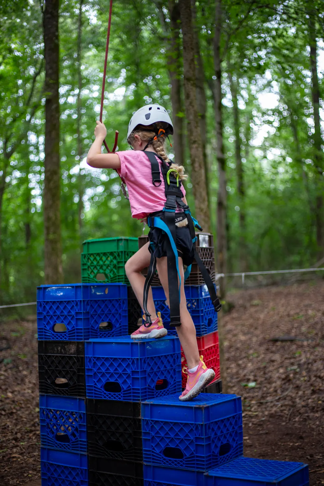 Camper climbing the crate stack