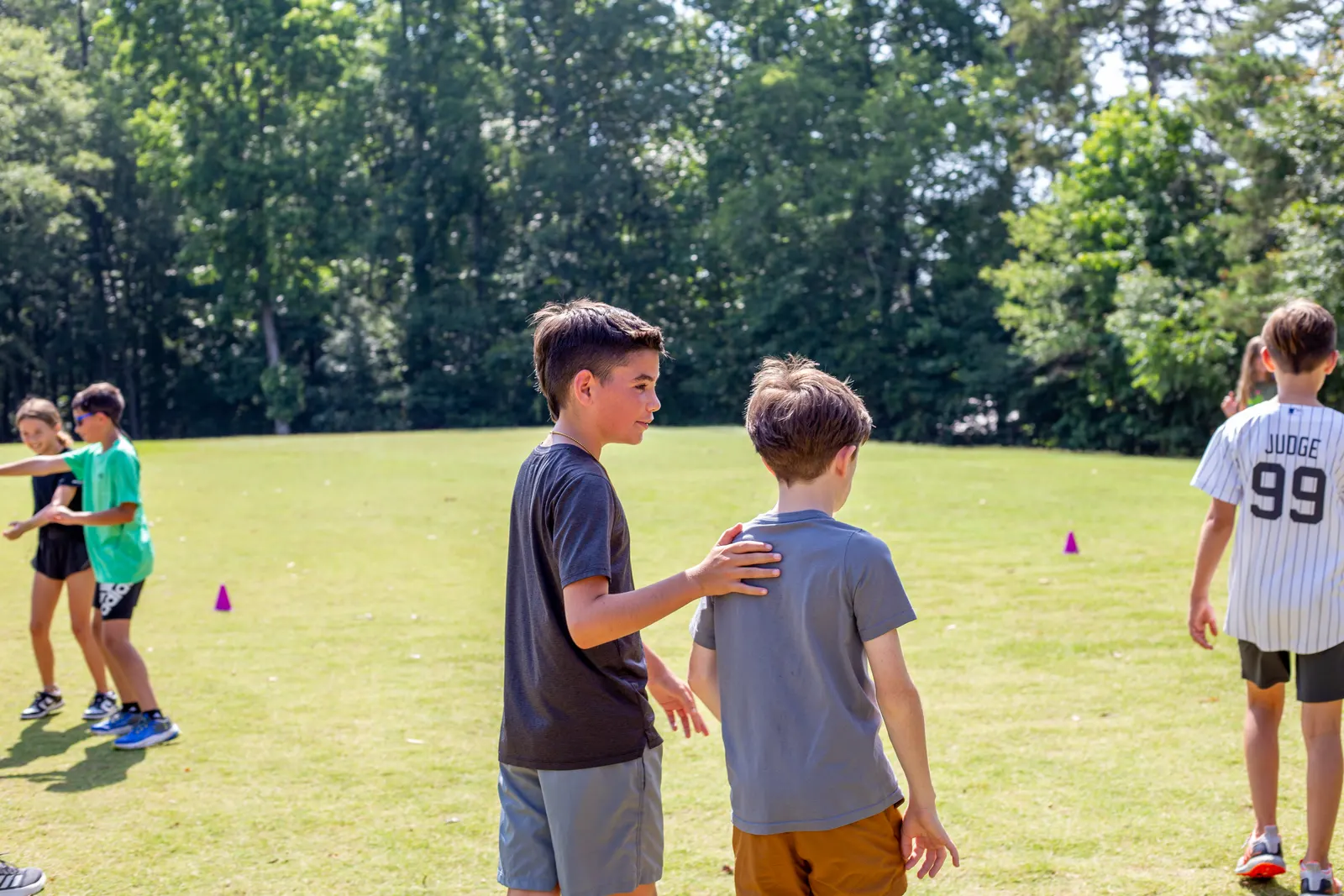 Campers playing field games