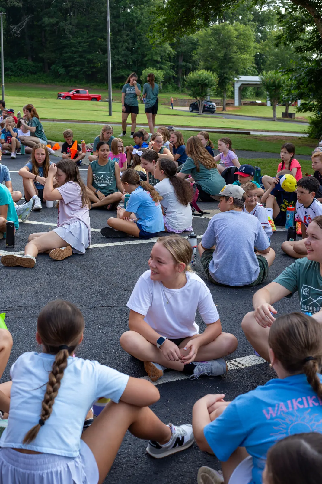 Campers sitting together at assembly
