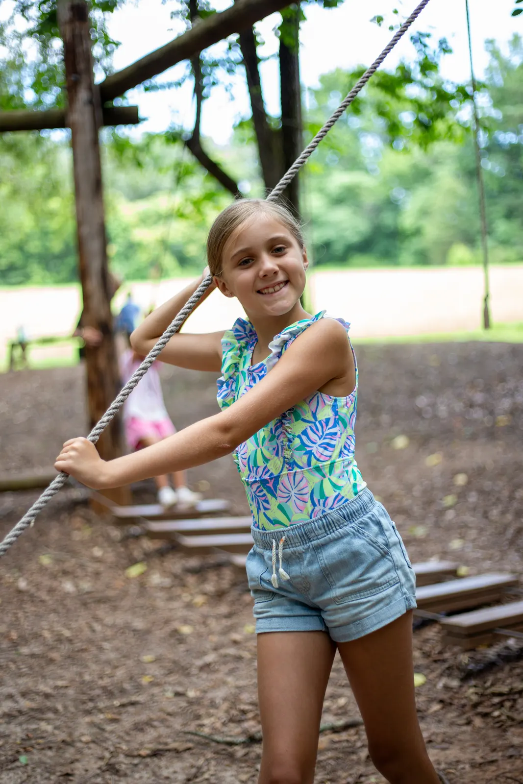 Camper playing on a stick fort