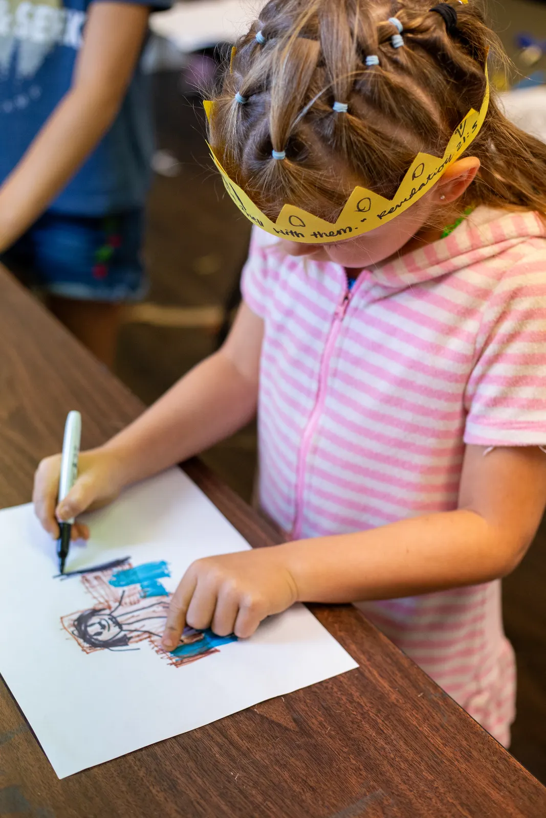 Camper drawing at a table